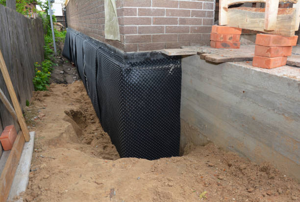 Happy homeowners after waterproofing job in Reva